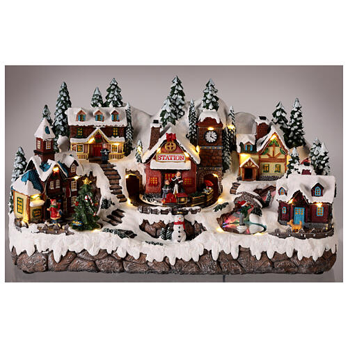 Christmas village with train in motion, snow and LED lights, 25x40x15 cm 2