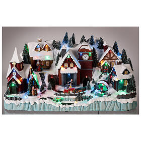 Christmas village with train in motion in a tunnel, LED lights, 30x50x30 cm