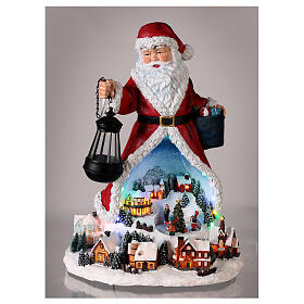 Santa with Christmas village and animated tree, LED lights, 50x35x30 cm