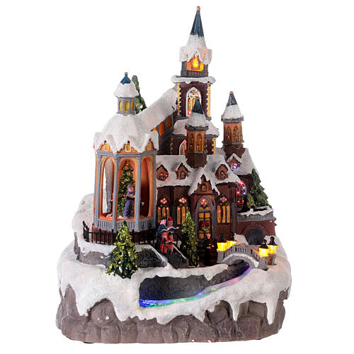 Christmas village set, church with Christmas tree, motion, lights and music, 25x25x35 cm, electricity/batteries 1