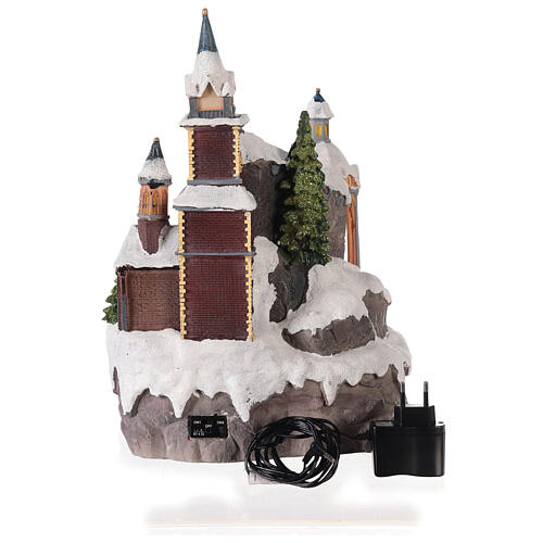 Christmas village set, church with Christmas tree, motion, lights and music, 25x25x35 cm, electricity/batteries 5
