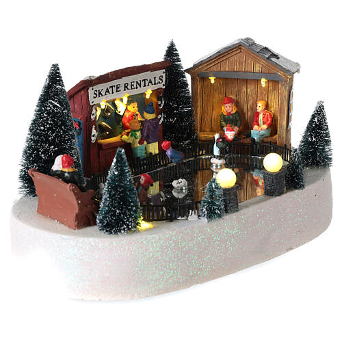 Village de Noël miniature piste de patinage mouvement musique LED 15x30x20 cm piles 4