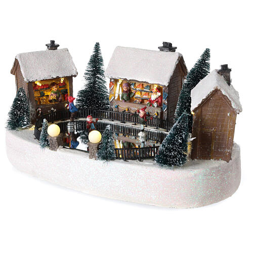 Christmas village set, ice rink with houses, motion music and LED lights, 15x30x20 cm, battery-powered 3