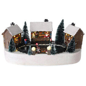 Cenário natalino pista de gelo com casas movimento música luzes LED 15x30x20 cm pilhas