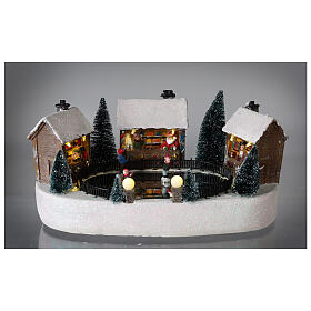 Cenário natalino pista de gelo com casas movimento música luzes LED 15x30x20 cm pilhas