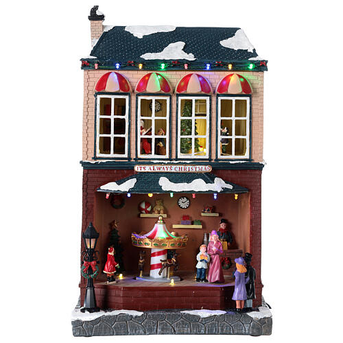 Weihnachtsdorf Haus mit Bewegung Musik und LEDs, 40x25x20 cm 1