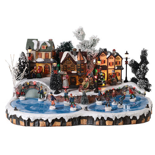 Christmas village set: ice rink with skaters in motion 20x40x35 cm 1