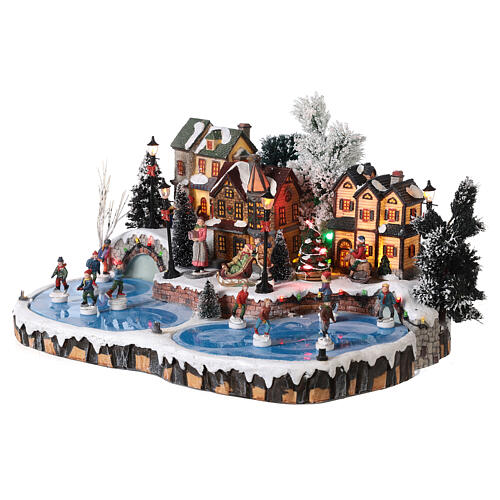 Villaggio natalizio pista di pattinaggio con movimento pattinatori 20x40x35 cm 3
