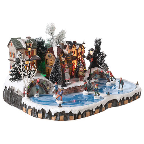 Villaggio natalizio pista di pattinaggio con movimento pattinatori 20x40x35 cm 4