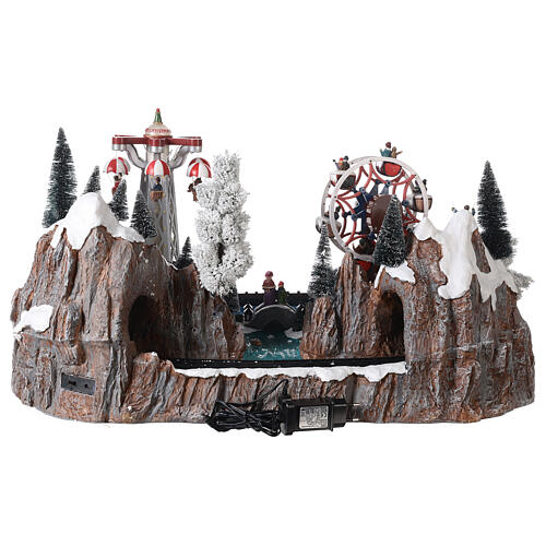 Christmas village set with train in motion, amusement park and skaters 40x70x50 cm 5