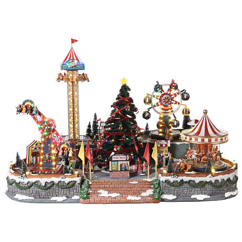 Pueblo navideño con luces, árbol de Navidad, parque de atracciones, tiovivos 60x90x60 cm 1