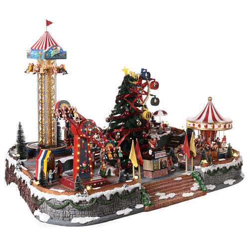 Pueblo navideño con luces, árbol de Navidad, parque de atracciones, tiovivos 60x90x60 cm 6