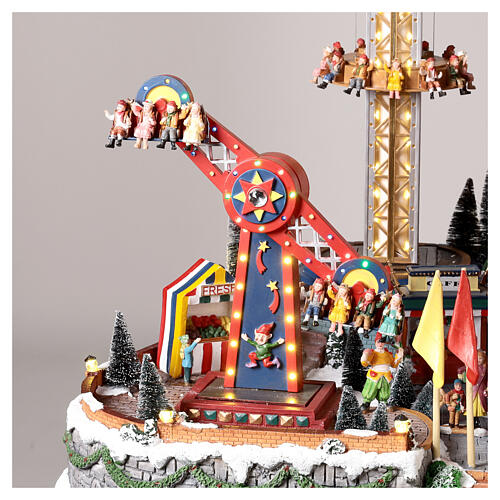 Pueblo navideño con luces, árbol de Navidad, parque de atracciones, tiovivos 60x90x60 cm 8