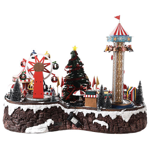 Pueblo navideño con luces, árbol de Navidad, parque de atracciones, tiovivos 60x90x60 cm 9