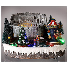 Christmas village: Colosseum with Christmas tree and merry-go-round, motion lights and music, 15x25x20 cm