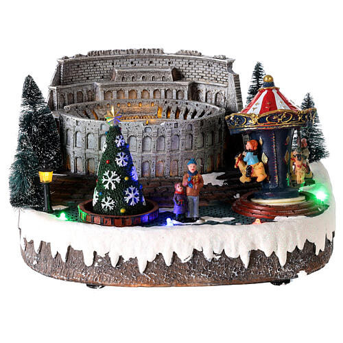 Christmas village: Colosseum with Christmas tree and merry-go-round, motion lights and music, 15x25x20 cm 1