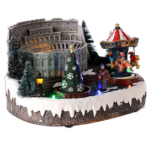 Christmas village: Colosseum with Christmas tree and merry-go-round, motion lights and music, 15x25x20 cm 3