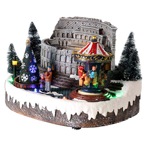Christmas village: Colosseum with Christmas tree and merry-go-round, motion lights and music, 15x25x20 cm 4