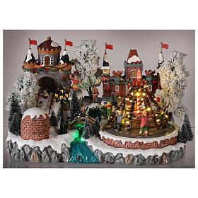 Christmas village: decorated merry-go-round, castle and sleigh ramp, motion lights and music, 25x35x25 cm
