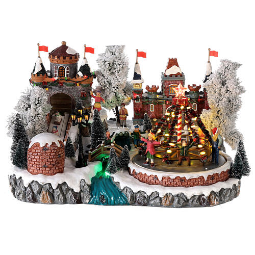 Christmas village: decorated merry-go-round, castle and sleigh ramp, motion lights and music, 25x35x25 cm 1