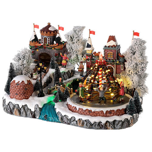 Christmas village: decorated merry-go-round, castle and sleigh ramp, motion lights and music, 25x35x25 cm 4