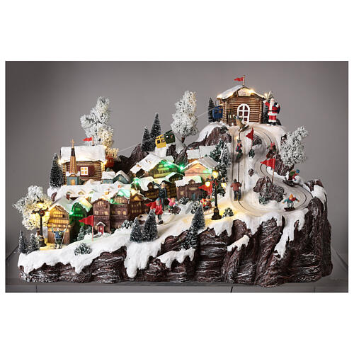 Christmas village set with ropeway, ski slope and skaters, music and lights, 40x60x50 cm 4