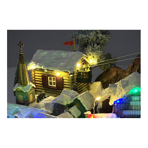 Pueblo Navidad teleférico pista de esquí patinadores música luces 40x60x50 cm 3