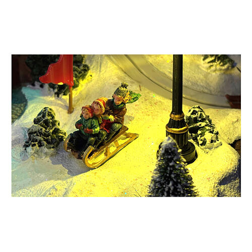 Pueblo Navidad teleférico pista de esquí patinadores música luces 40x60x50 cm 7