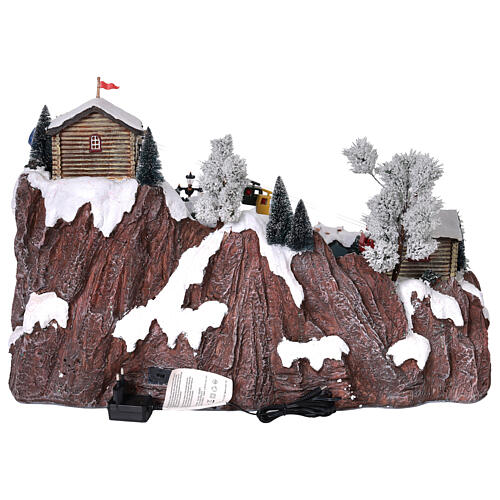 Pueblo Navidad teleférico pista de esquí patinadores música luces 40x60x50 cm 8