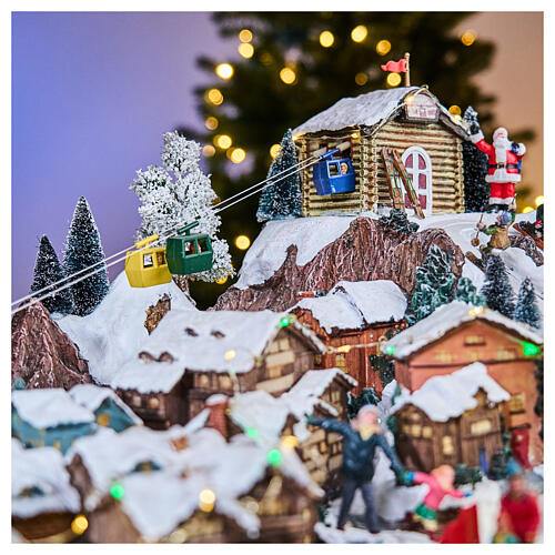 Pueblo Navidad teleférico pista de esquí patinadores música luces 40x60x50 cm 10