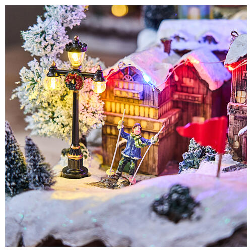 Pueblo Navidad teleférico pista de esquí patinadores música luces 40x60x50 cm 11