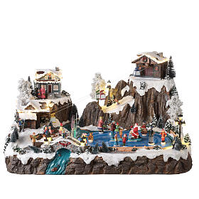 Christmas village set with ski resort and skiers, 40x60x45 cm, lights and music