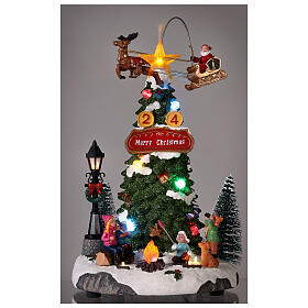 Cenário natalino: fogueira, árvore de Natal e Pai Natal em movimento 30x20x20 cm