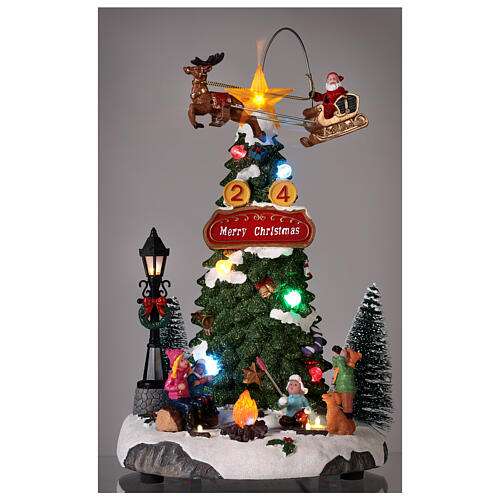 Cenário natalino: fogueira, árvore de Natal e Pai Natal em movimento 30x20x20 cm 2