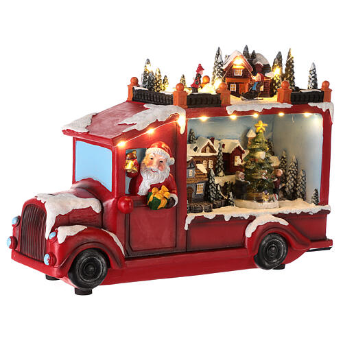 Ciężarówka ze Świętym Mikołajem, oświetlenie i ruch, 20x30x10 cm 7