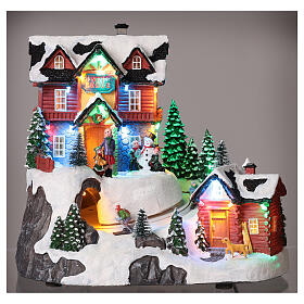 Christmas village set with skiers in motion and lights 10x10x8 in