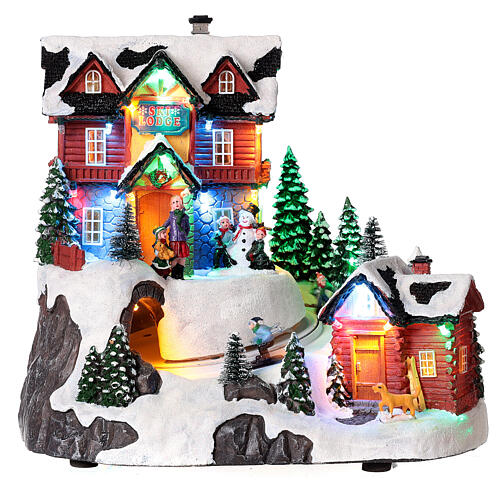 Christmas village set with skiers in motion and lights 10x10x8 in 1