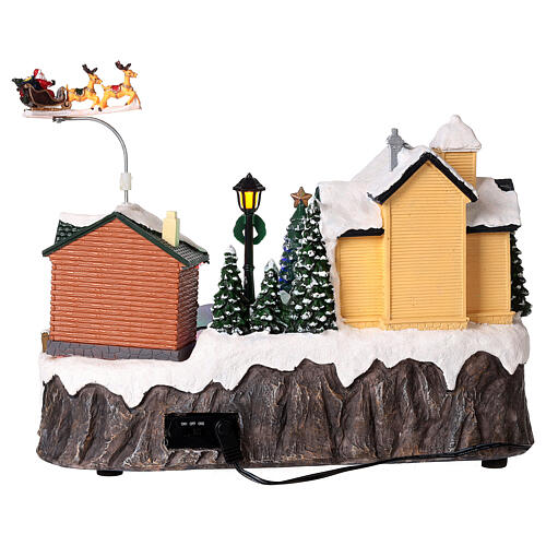 Christmas village set: houses and Santa in motion 10x12x6 in 5