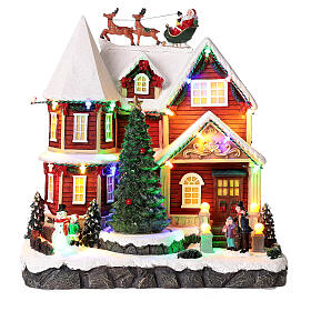 Christmas village set: house with Santa above it 10x10x8 in