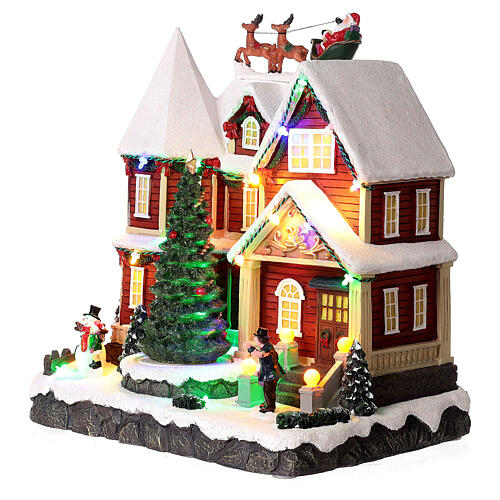 Christmas village set: house with Santa above it 10x10x8 in 3