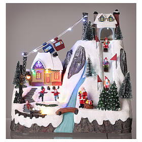 Christmas village set: sledders and skaters 12x12x8 in