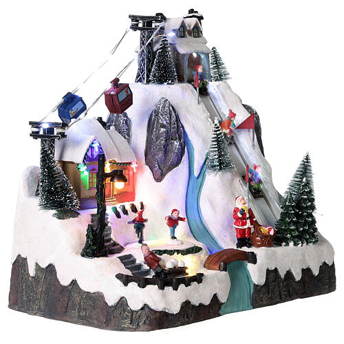 Christmas village animated skaters and sledders 30x30x20 cm 4