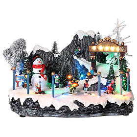 Christmas village set: skaters and snowman 8x14x8 in