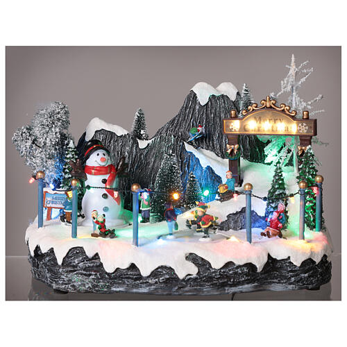Christmas village set: skaters and snowman 8x14x8 in 2