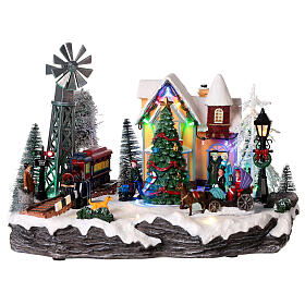 Christmas village set with train and Christmas tree in motion 8x10x14 in