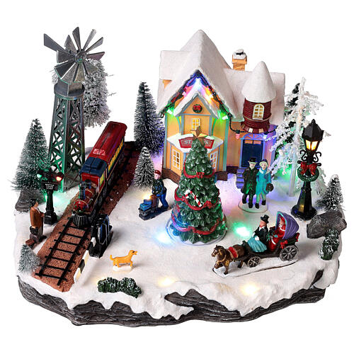 Christmas village set with train and Christmas tree in motion 8x10x14 in 3