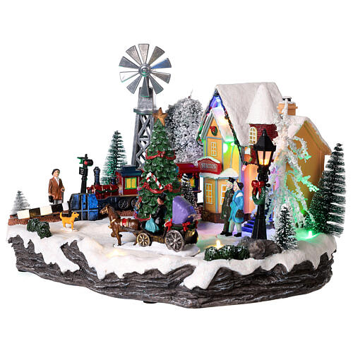 Christmas village set with train and Christmas tree in motion 8x10x14 in 4