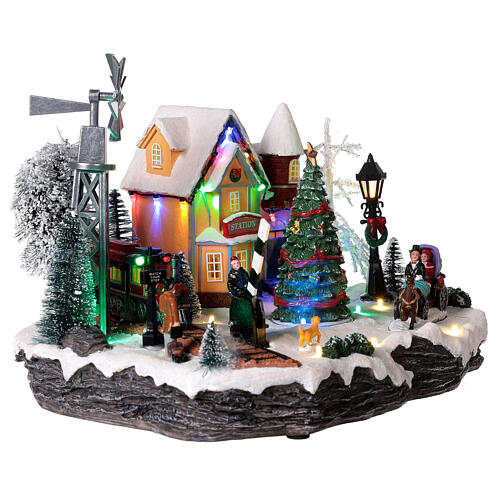 Christmas village set with train and Christmas tree in motion 8x10x14 in 5
