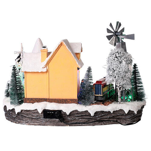 Christmas village set with train and Christmas tree in motion 8x10x14 in 6
