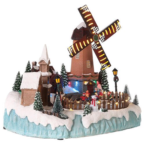 Christmas village set with mills and skaters 14x14x12 in 4